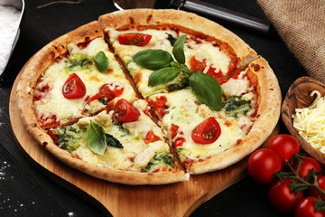 vegetarian italian Pizza with tomatoes, mozzarella cheese  and basil. Delicious italian pizza