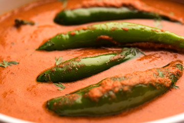 Hyderabadi mirch/mirchi ka Salan or green chilly sabzi or curry. Main course recipe from India. served in a bowl. selective focus