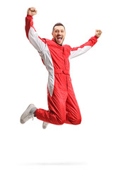 Racer in a red uniform jumping and gesturing happiness