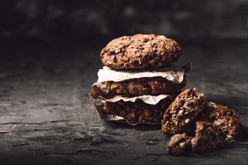 Sweet cookies with on dark textured background.