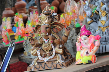 A Beautiful clay statue/Idol of an Indian god Lord Ganesha decorated with colourful drapery and...