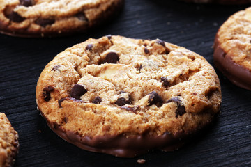 Chocolate cookies on wooden table. Chocolate chip cookies shot on table