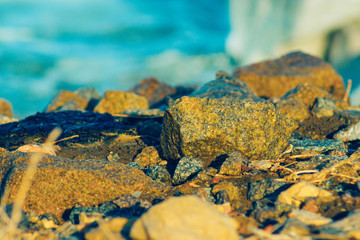 lakeside with stones and blue water