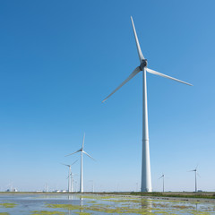 wind turbines and blue sky in the north of dutch province groningen near eemshaven