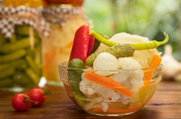 Delicious homemade organic different vegetable preserved in vinegar or brine.