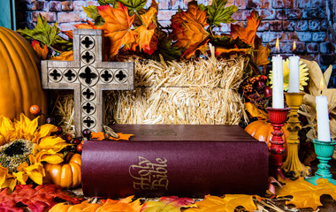 giving thanks on Thanksgiving day with old bible and wood cross