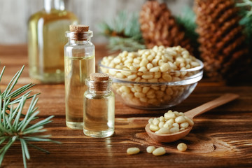 Pine nuts and bottles of essential oil.