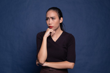 Serious  young Asian woman  look away.