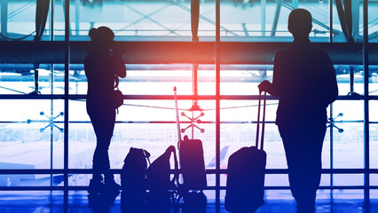 Two passengers waiting to transit flight at the airport. (use one model)