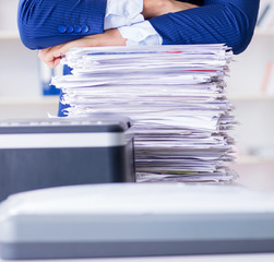 Businessman making copies in copying machine
