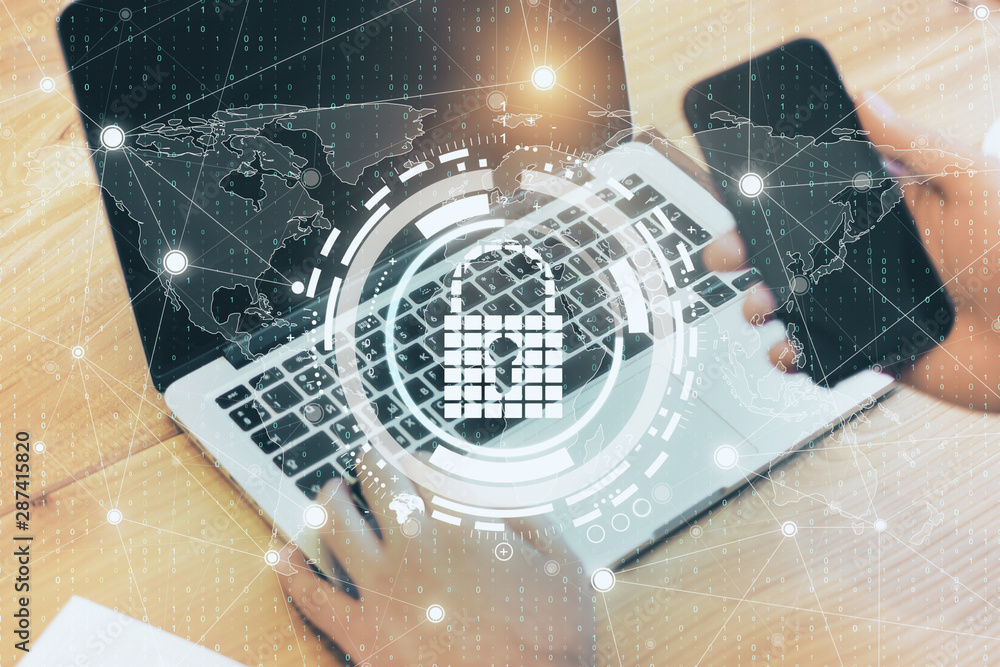 Poster Hands using computer with padlock