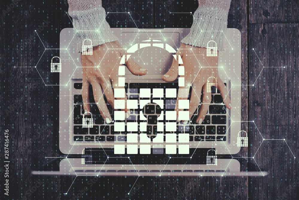 Poster hands using laptop with padlock