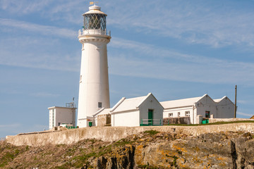 Fototapeta na wymiar The South Stack Lighthouse is built on the summit of a small island off the north-west coast of Holy Island, Anglesey, Wales. It was built in 1809 to warn ships of the dangerous rocks below.