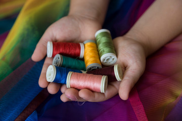 the colorful ropes on the hand on background.