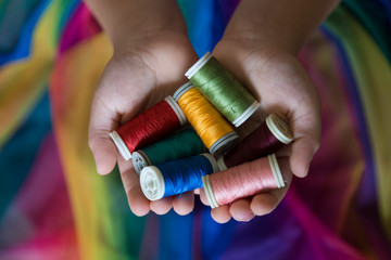 the colorful ropes on the hand on background.