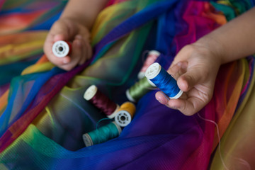 the colorful ropes on the hand on background.