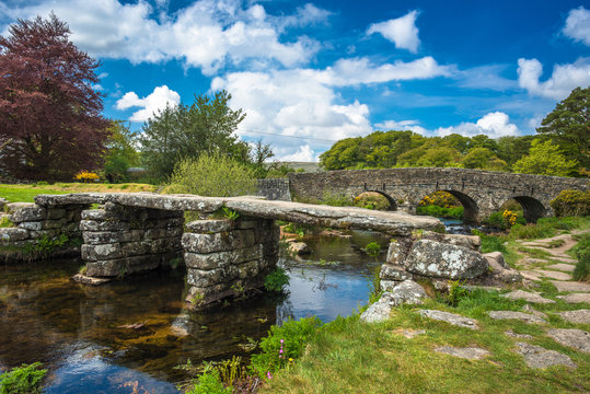 Medieval clapper bridge over the East Dart River at Postbridge on Dartmoor in Devon