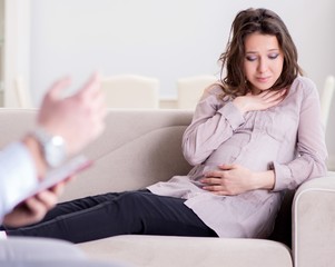 Pregnant woman visiting psychologist doctor