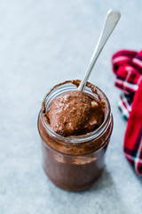 Homemade Organic Raw Nut Chocolate Cream in Spoon.