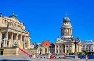 Obraz premium The Gendarmenmarkt square in Berlin, Germany which houses the Berlin Concert Hall (Konzerthaus) and the French and German Churches.