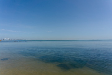 Sea waves. Sea of Crimea. High waves in clear weather. Sunny day at sea. Background blue sea waves. Sand beach. Clean beach.