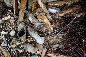 old shoes and garbage in an abandoned house
