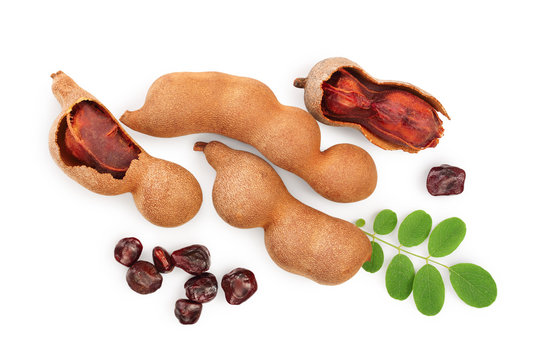 Tamarind fruit with leaf and seed isolated on white background, Top view. Flat lay