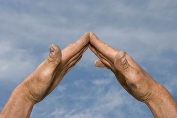 Hands making the shape of a house. Building. Roof