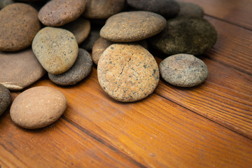 Fototapeta na wymiar zen stones on wooden background