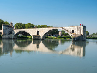 Fototapeta na wymiar France, july 2019: Saint Benezet bridge and Palace of the Popes in Avignon in a beautiful summer day