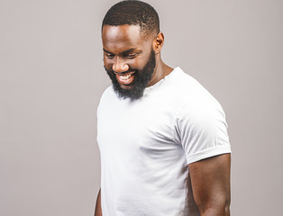 Portrait Of Happy smiling Young African american Man isolated Over grey Background.