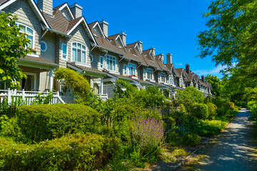 Fototapeta na wymiar Residential townhouses on sunny day in Vancouver, British Columbia, Canada.