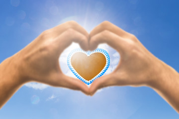 Obraz premium Lebkuchenherz in einer Hand in Herzform