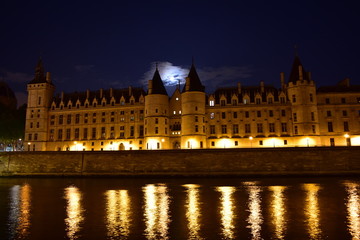 La Conciergerie from Seine River walk at night. Paris, France.