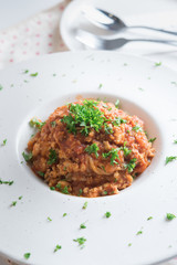 Spaghetti bolognese with tomato sauce on plate.