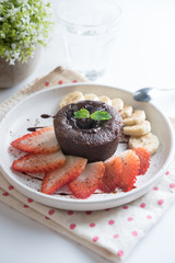 Chocolate lava with banana and strawberry