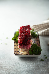 Traditional Russian herring salad with beetroot