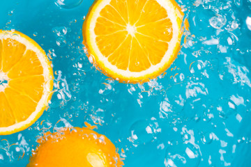Orange fruits fall deeply under water