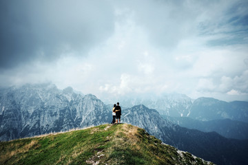 people in mountains, background alps, wonderful travel concept, space for text, atmospheric epic moment