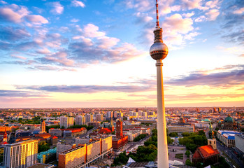 A view of the television tower (Fernsehturm) over the city of Berlin, Germany at sunset.