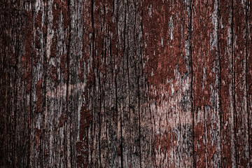 Old peeling paint on a wooden surface. background of retro wall painted in red paint