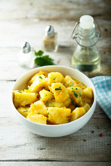 Homemade potato stew in white bowl
