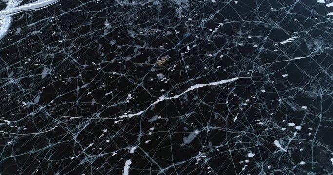 Aerial: Amphibious vehicle floats on Lake Baikal