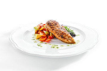 Macro Shot of Grilled Chicken Fillet with Side Dish of Baked Vegetables