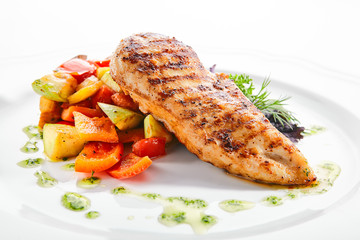 Macro Shot of Grilled Chicken Fillet with Side Dish of Baked Vegetables