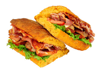 Sausage and bacon filled ciabatta bread sandwiches with lettuce and tomato isolated on a white background