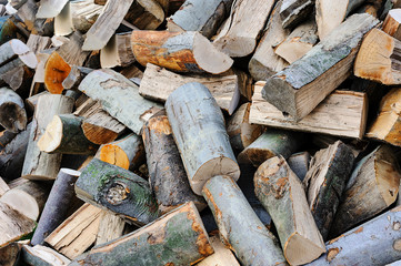 Concept image of preparing firewood for the winter - pile of chopped firewood.