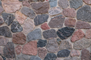 Wall of chipped stone. Close-up.