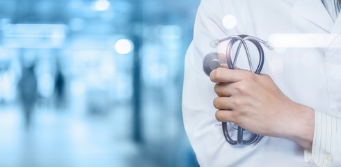 Medicine doctor with stethoscope in hand .