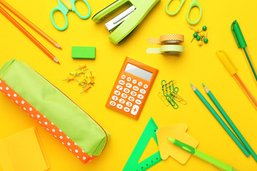 School supplies on yellow background. Minimalism concept